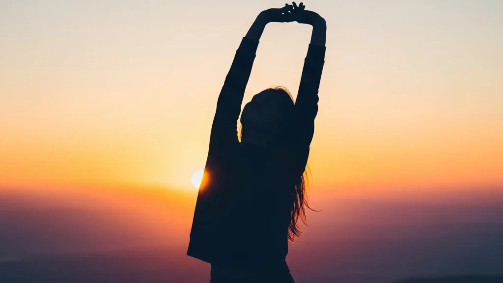 A silhouette of a woman who is fit, healthy and wealthy